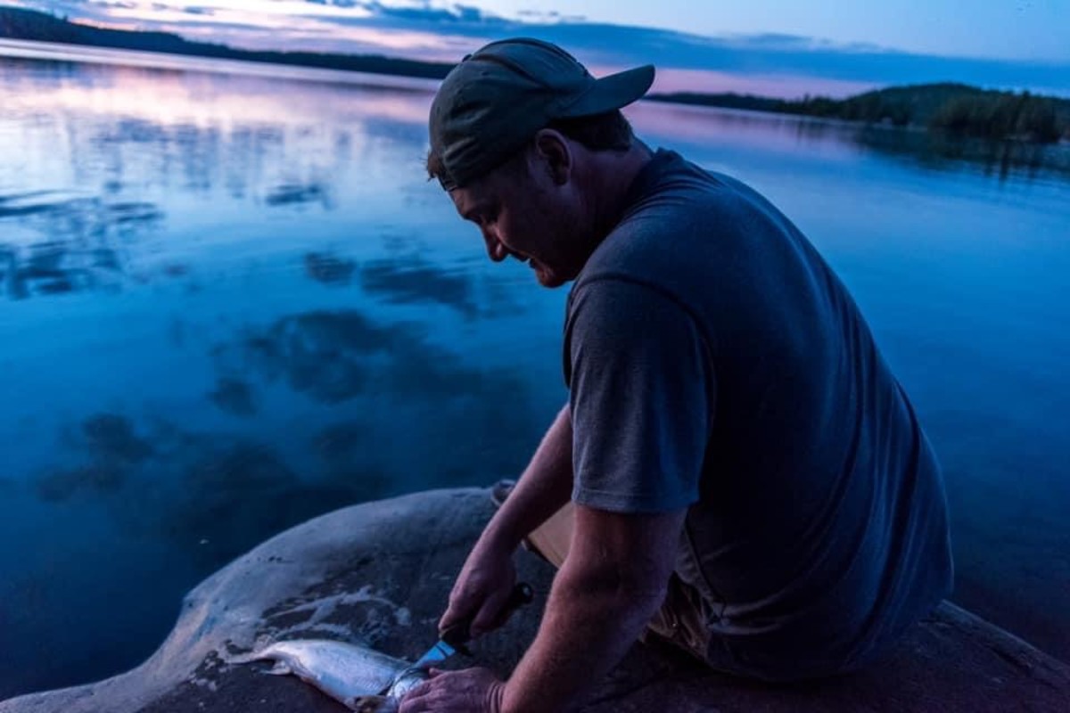 Jim Baird filleting fish